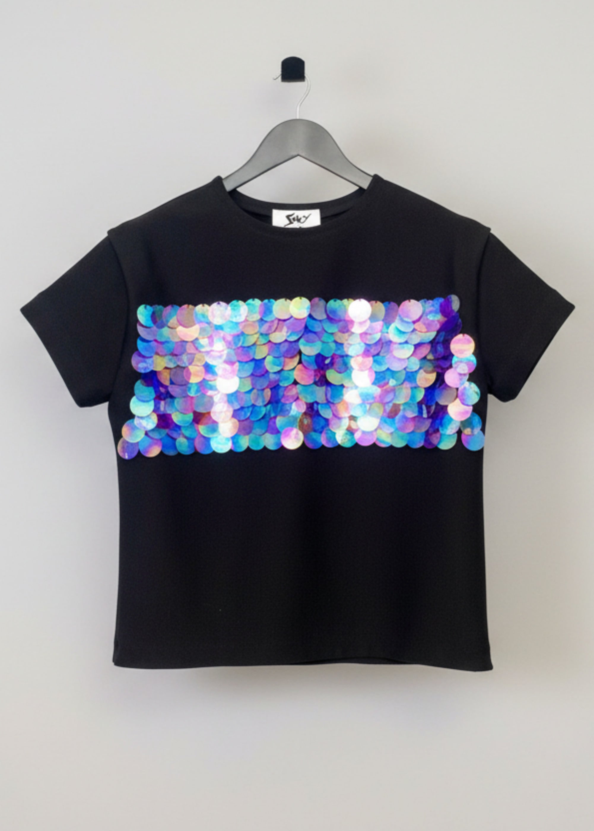 Stacy Stewart Smith Men's Dragon Scales Flange T-Shirt front view on a hanger with gray background. 