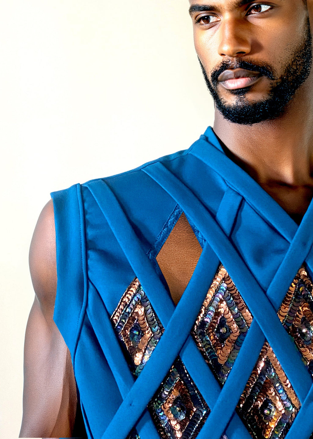 Stacy Stewart Smith Men's Rhombus Labyrinth Pullover Sleeveless Knit Top on mannequin 6'3" front view right closeup with keyhole opening.