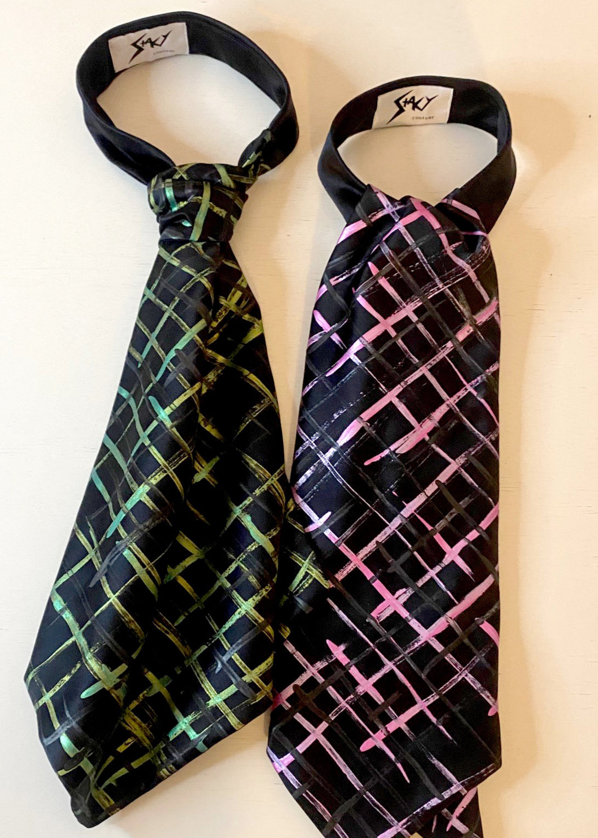 Stacy Stewart Smith Silk Satin Crosshatch Cravat in Shocking Pink and Peridot on black with white shirt on ivory surface.