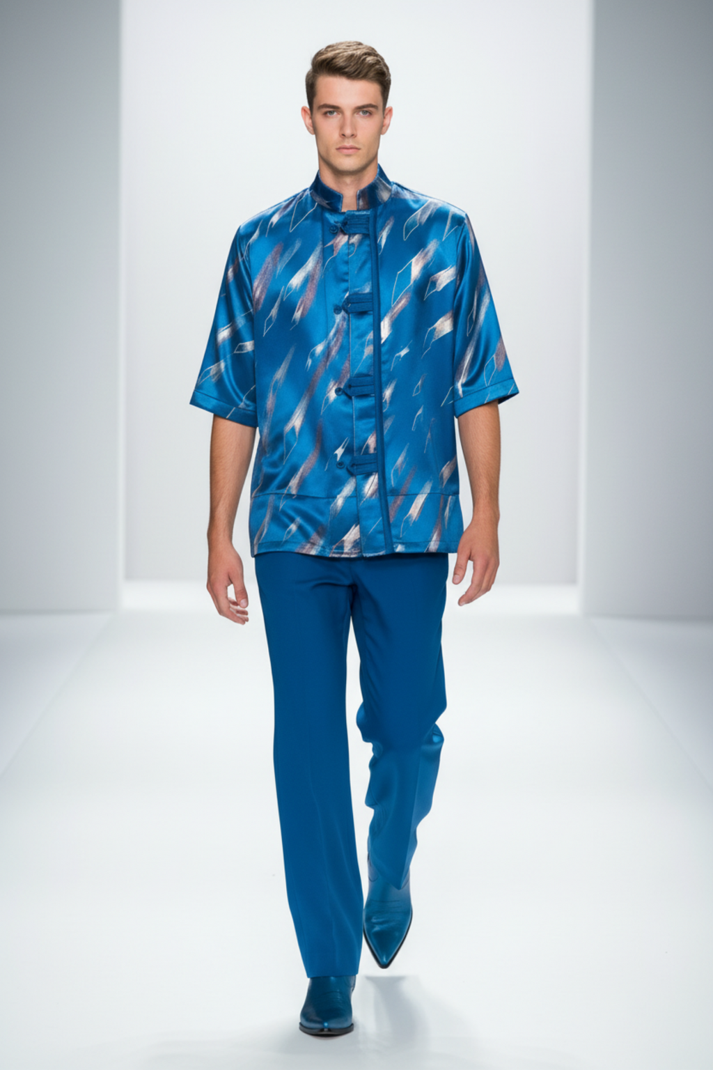 Stacy Stewart Smith Men's Rhombus Shower Hand-Painted Pool Shirt-Jacket on mannequin 6'3" walking in fashion show frontal view with long blue pants with white background.