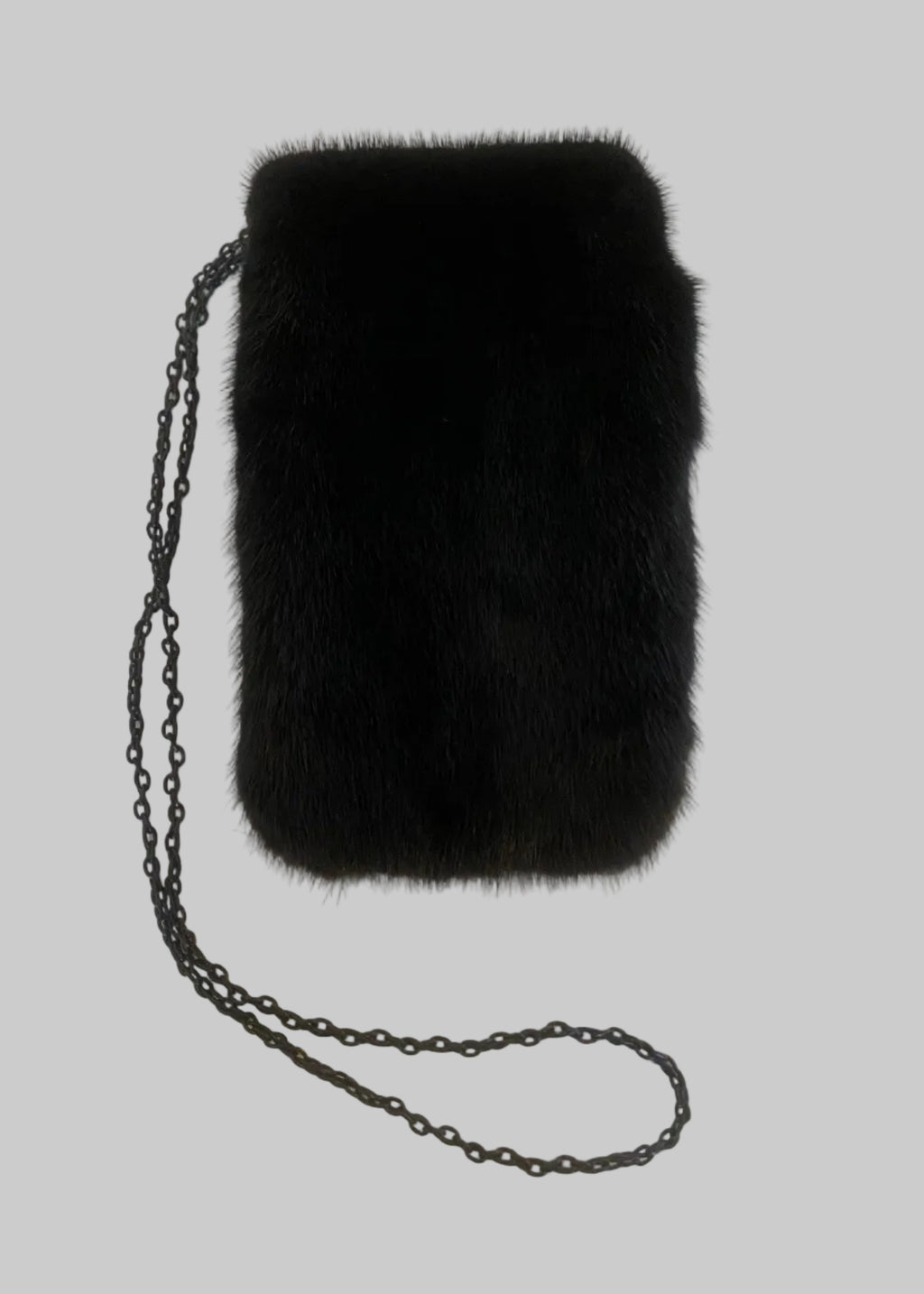 Stacy Stewart Smith Men's Black Gamma mink Sporran Pocket Bag flat back view with the flap closed showing on a gray surface.