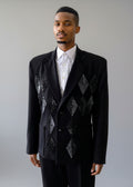 Stacy Stewart Smith Men's Black Knit, Sequin and Beaded Harlequin Blazer on mannequin 6'3" front view in room with wood floor and against antique white wall.