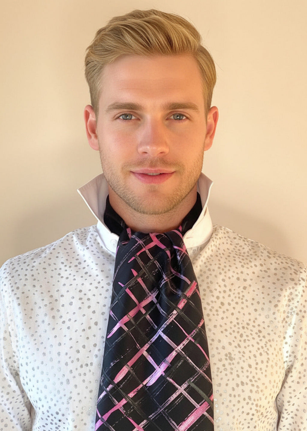 HOW TO TIE A CRAVAT: STEP 7 Atelier Quarterly presents Stacy Stewart Smith's Hand-Painted Cotton Percale Shirt and Hand-Painted Silk Cravat in Onyx/Shocking on a male mannequin front view with collar up against an ivory backdrop.