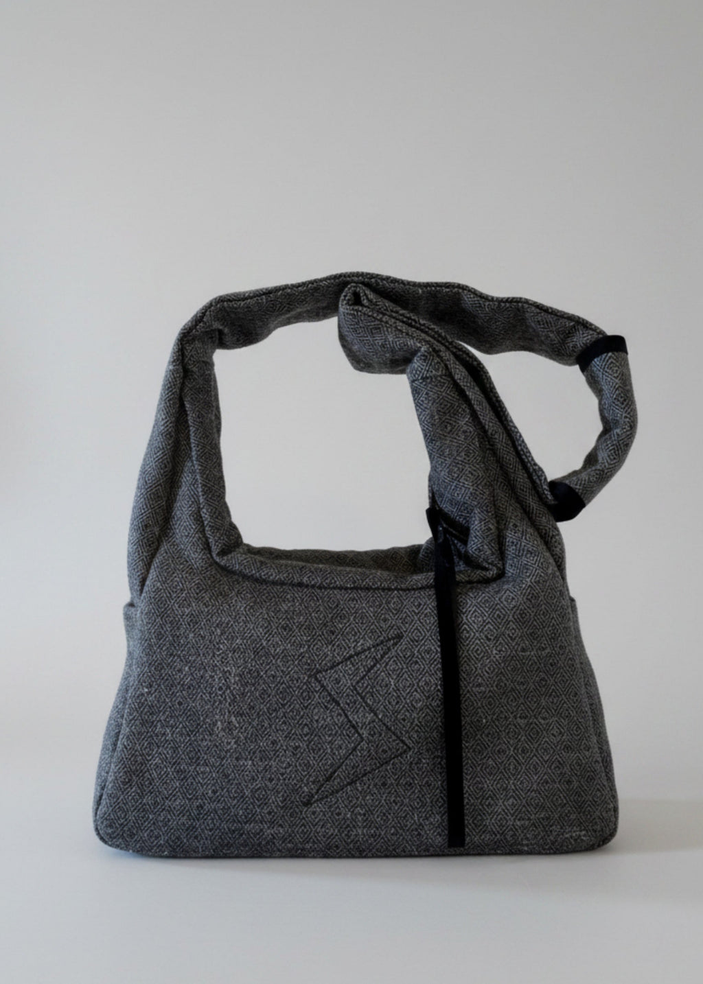 Stacy Stewart Smith's Men's Diamond Dodger Trapezoid messenger bag in Cement/Onyx frontal view against a gray background.