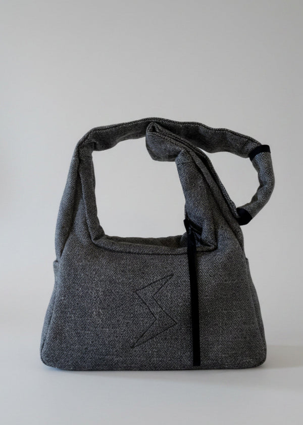 Stacy Stewart Smith's Men's Diamond Dodger Trapezoid messenger bag in Cement/Onyx frontal view against a gray background.