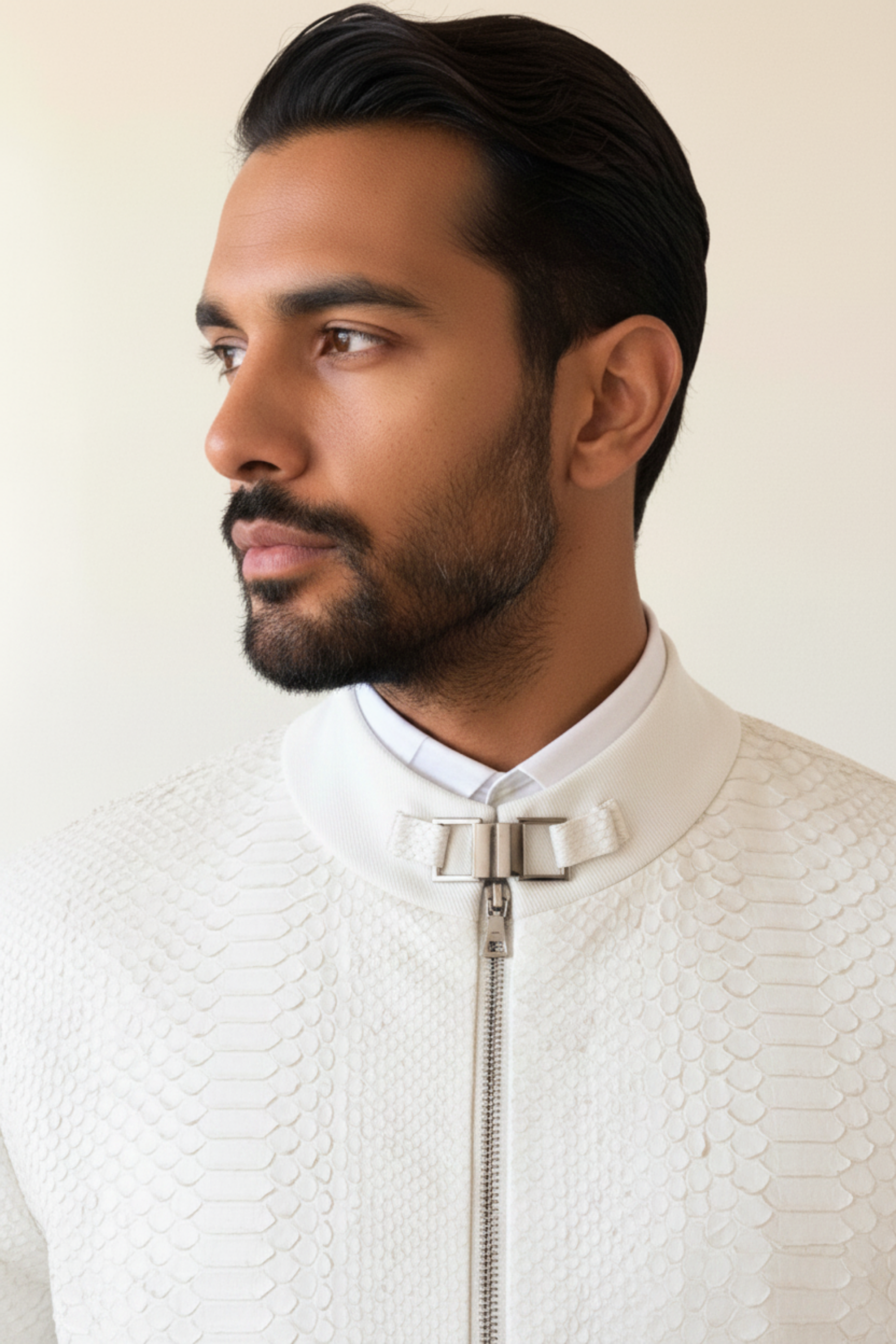 Stacy Stewart Smith Men's White Python & Denim Bellhop Jacket on mannequin 6'3" zoomed neck view with antique white wall backdrop.