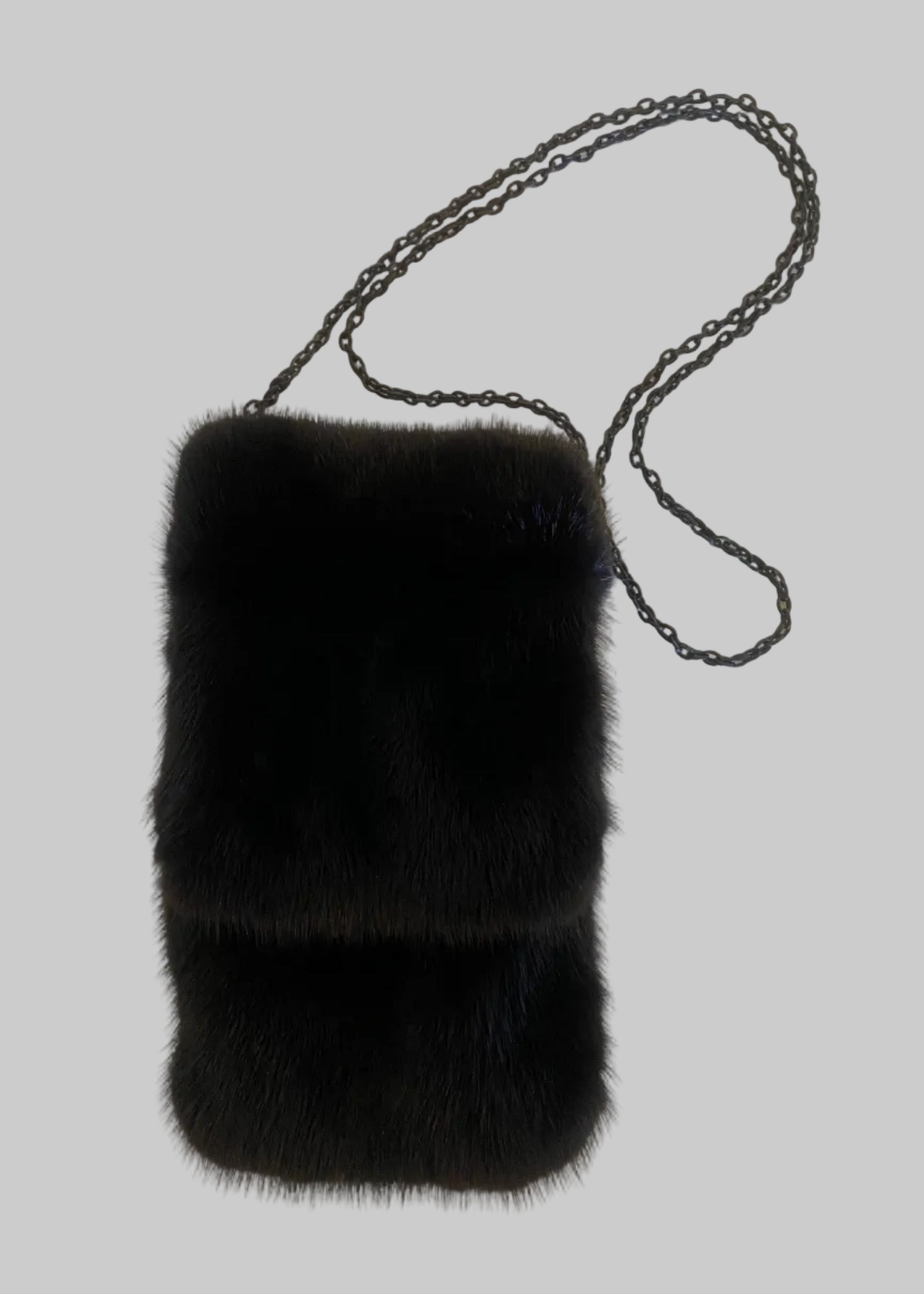 Stacy Stewart Smith Men's Black Gamma mink Sporran Pocket Bag flat front view with the flap closed showing on a gray surface.