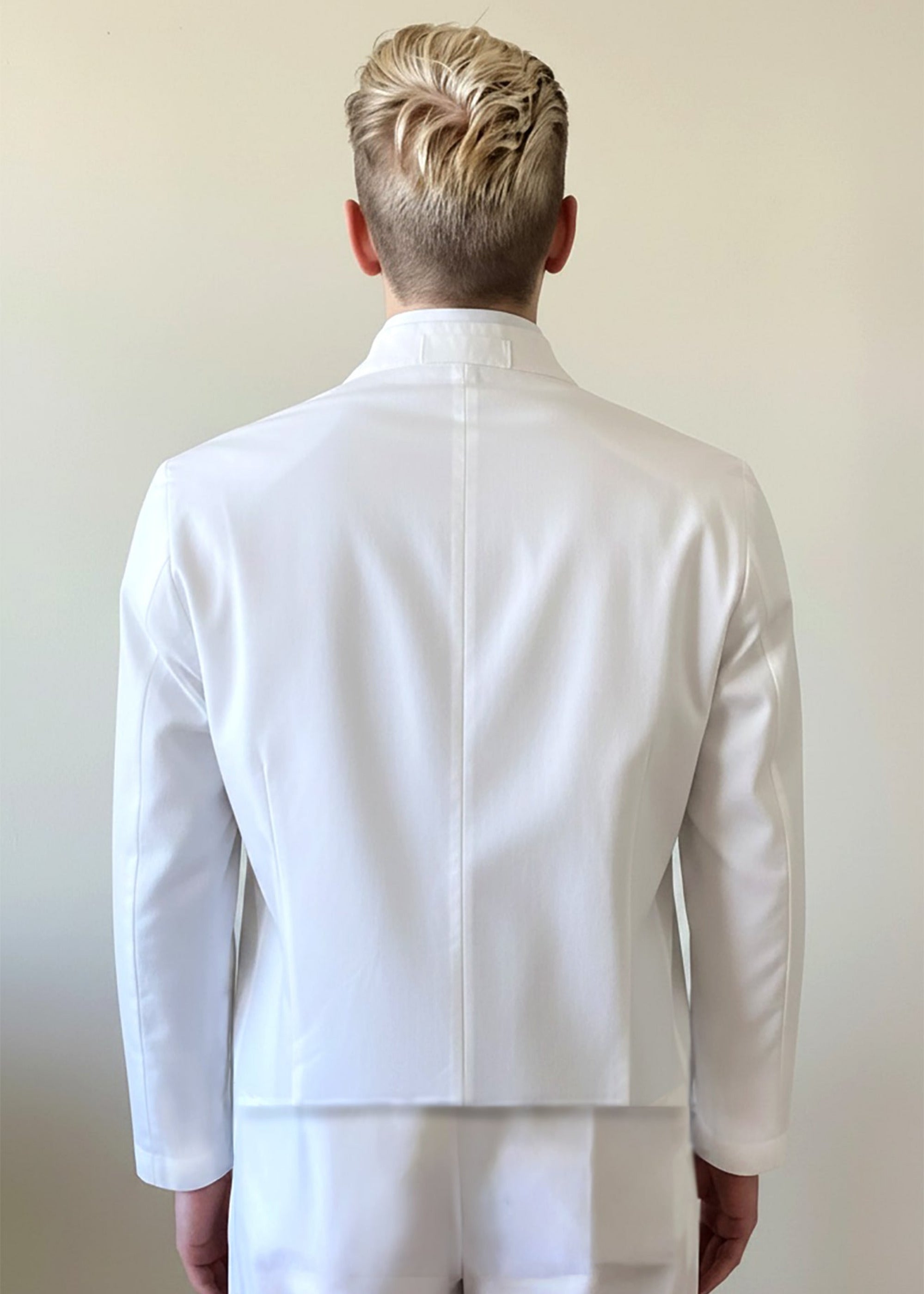 Stacy Stewart Smith Men's White Python & Denim Bellhop Jacket on a mannequin 6'3" zoomed back view with antique white wall backdrop. 