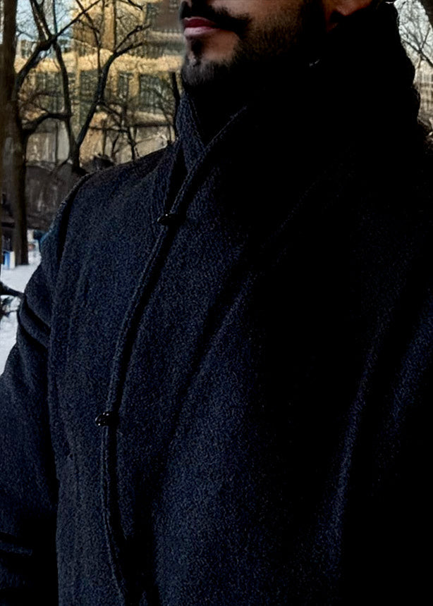 Stacy Stewart Smith Men's Harris Tweed Wool Processional Great Coat on a mannequin 6'3" on an urban street with trees and buildings showing the coat closeup without the fur collar.