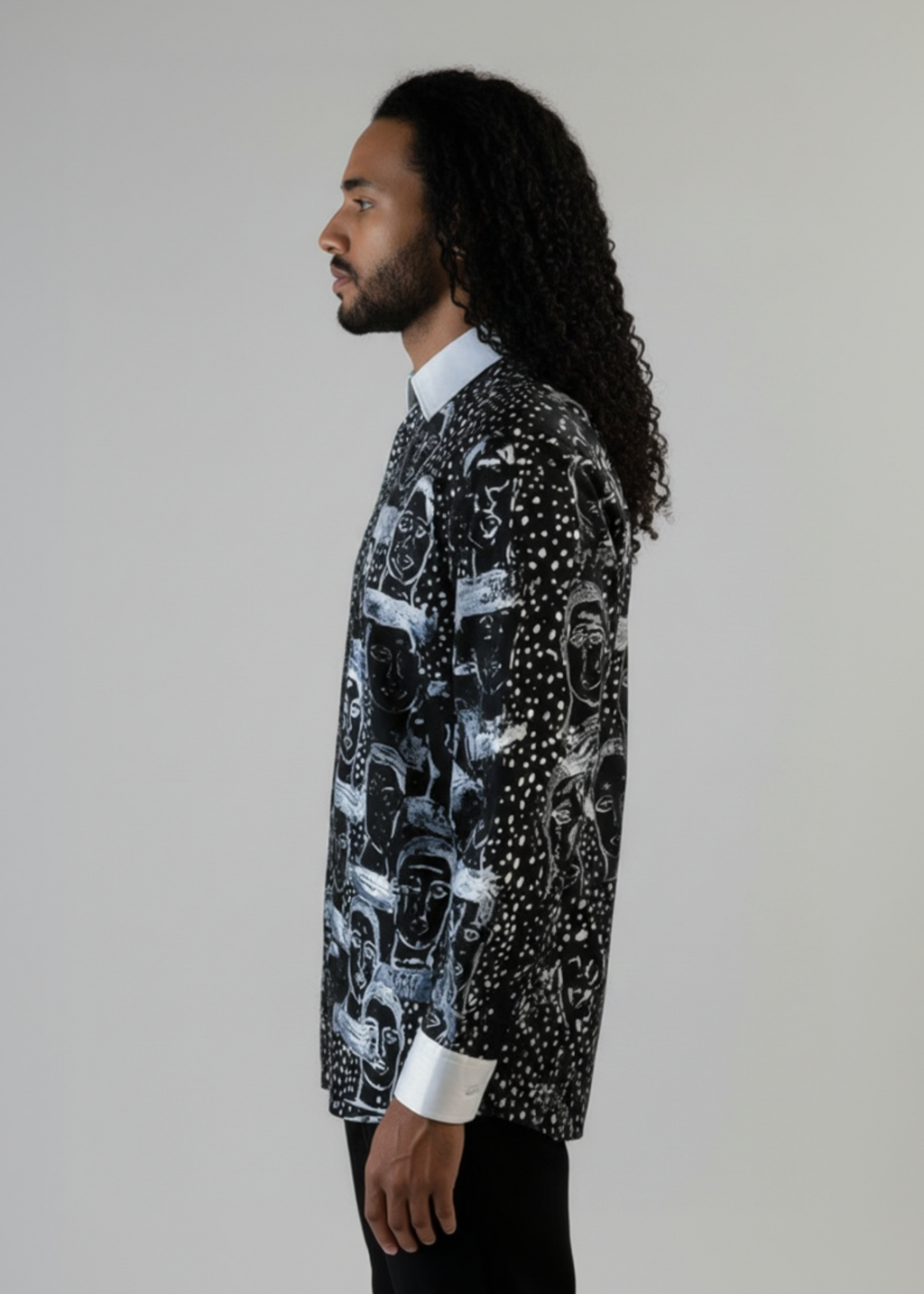 Stacy Stewart Smith Men’s Pawns in Silver on Black Hand-Painted Premium Cotton Percale Dress Shirt tucked into black suede pants on a mannequin 6'3" side view  in front of gray backdrop.