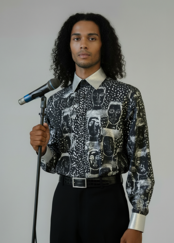 Stacy Stewart Smith Men’s Pawns in Silver on Black Hand-Painted Premium Cotton Percale Dress Shirt tucked into black suede pants on a  mannequin 6'3"holding a microphone as an entertainer 3/4 view  in front of gray backdrop.