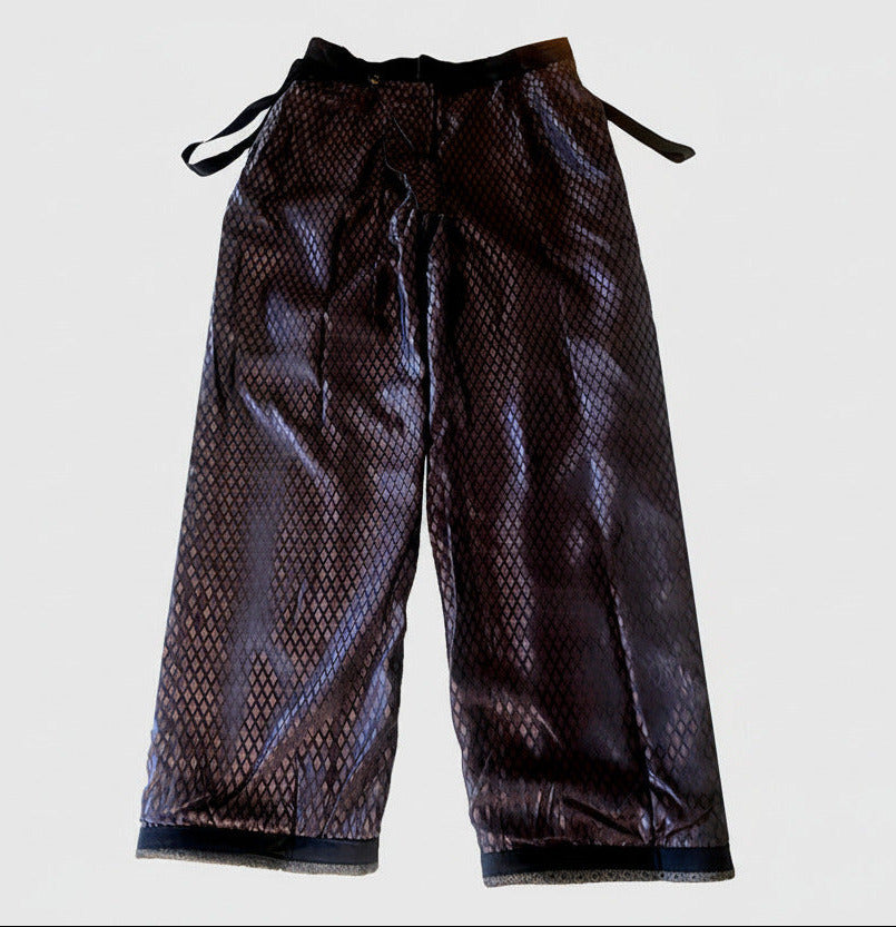 Stacy Stewart Smith Men's Diamond Dodger Tailored 3-Piece Tweed Suit back view inside pants only with rhombus patterned acetate lining showing and brand labels on a white backdrop.