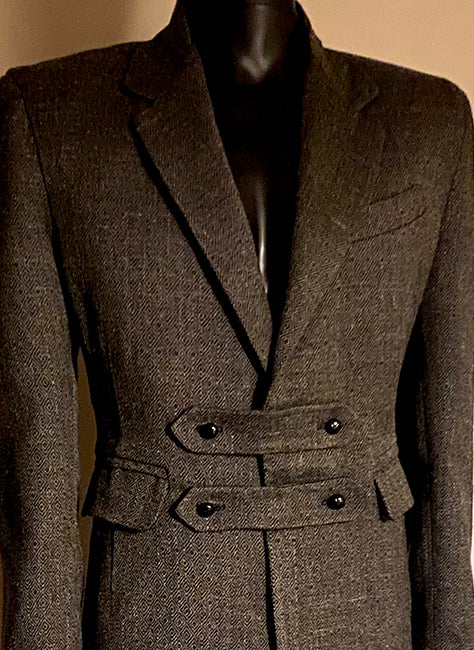Stacy Stewart Smith — Highland Gentry Tweed Suit design study. Double-breasted belted tweed suit on mannequin, front detail view.