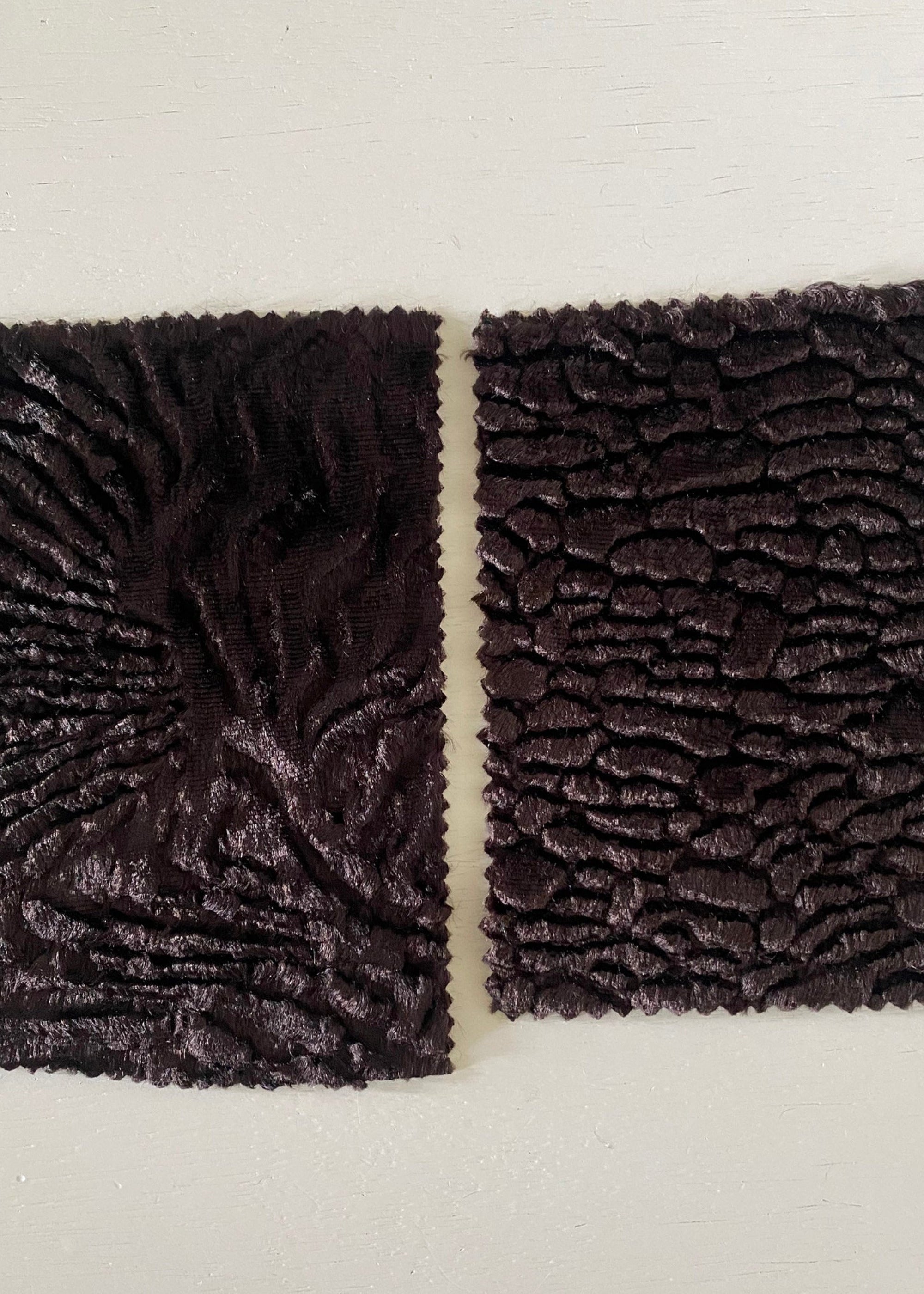 Stacy Stewart Smith sample swatches of Espresso sculptural pile fabrics available for Fall in Faux Persian Lamb and Woodgrain textures.