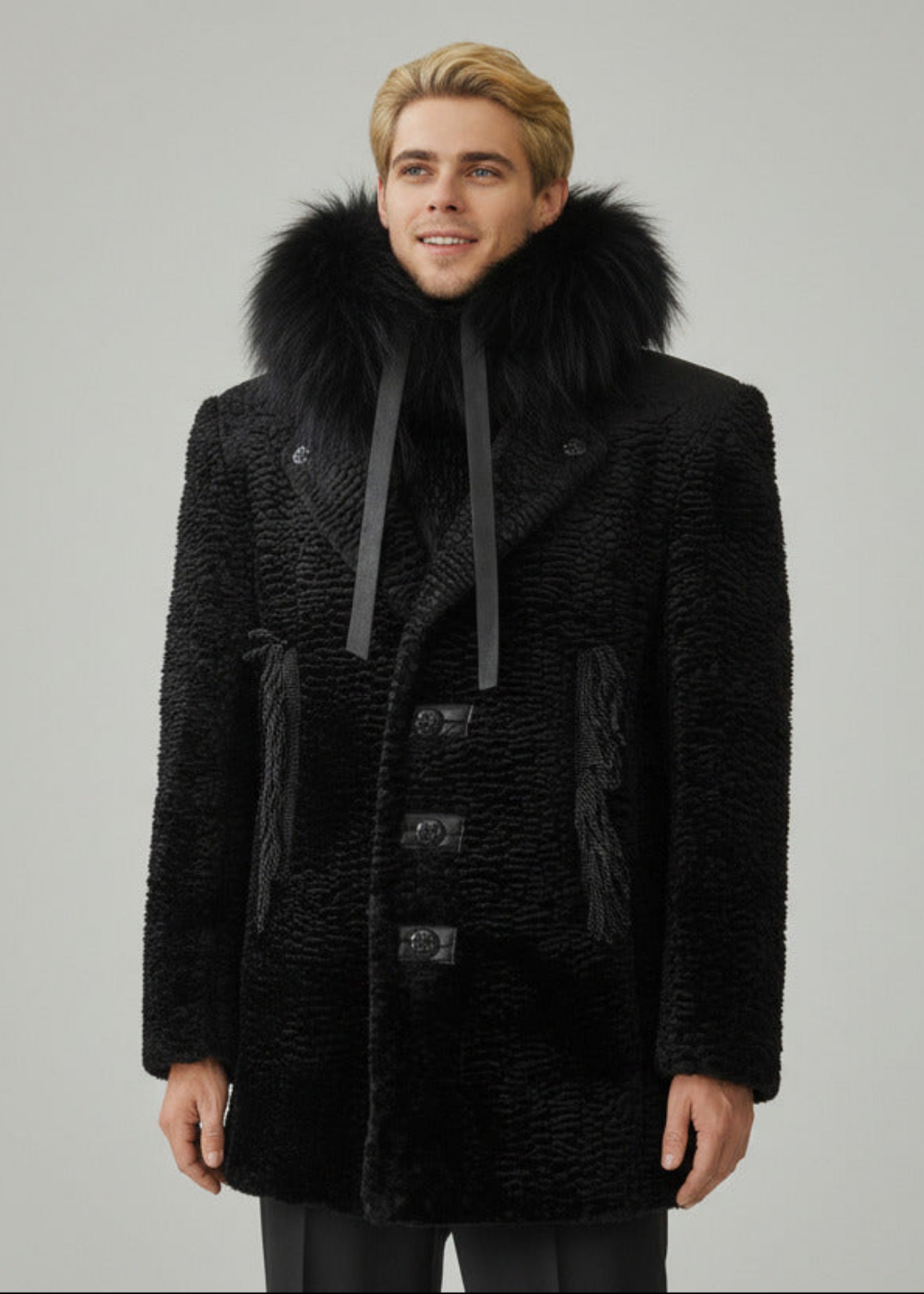 Stacy Stewart Smith Men's Black Knight Faux Persian Lamb Coat in Coal Black, with hood down in front view shown on mannequin at 6'3