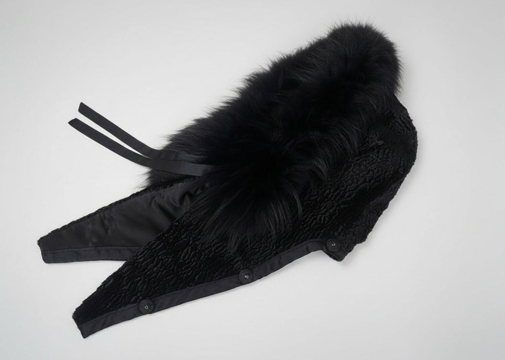 Stacy Stewart Smith Men's Black Knight Faux Persian Lamb Coat in Coal Black, detached hood side view on white surface