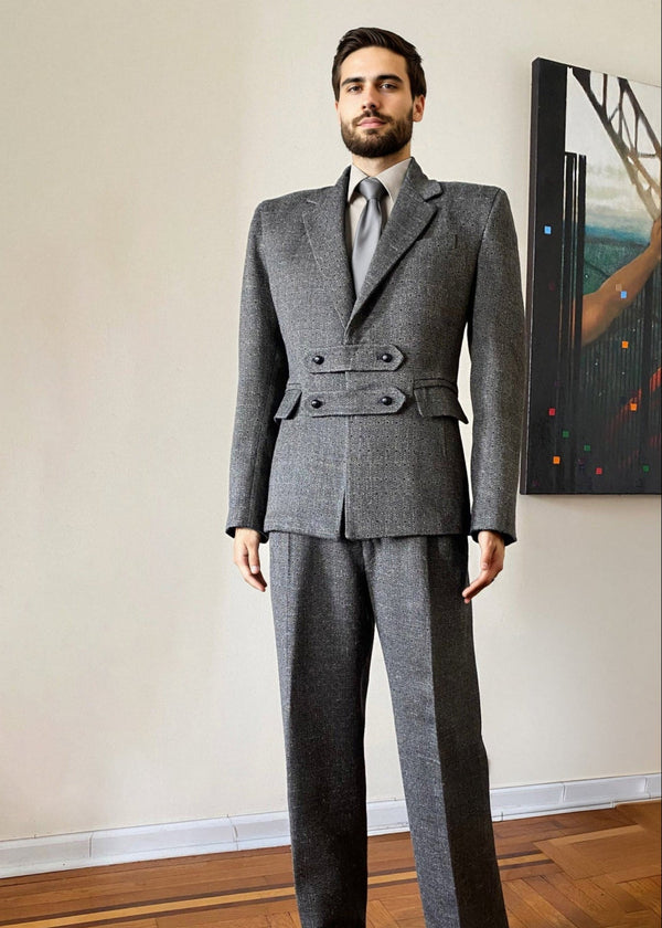 Stacy Stewart Smith Men's Highland Gentry Diamond Tweed Suit in Cement on mannequin 6'3" standing frontal in a room with an Antique White wall, an oil painting entitled Faith on the wall, and on a wooden floor.