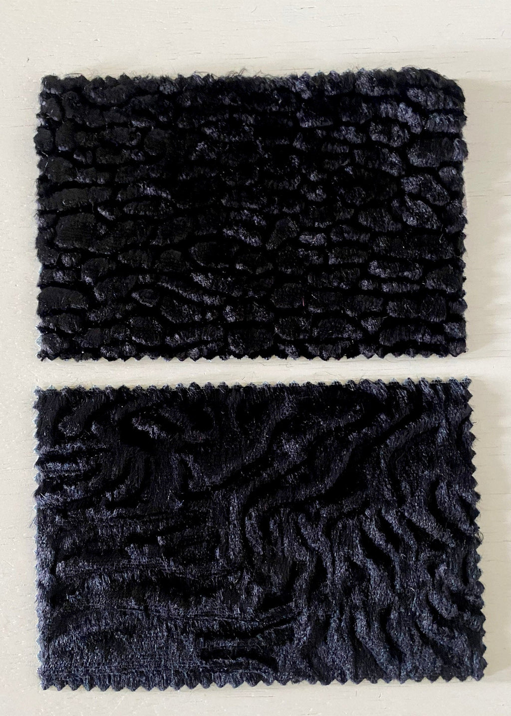 Stacy Stewart Smith sample swatches of Onyx sculptural pile fabrics available for Fall in Faux Persian Lamb and Woodgrain textures.