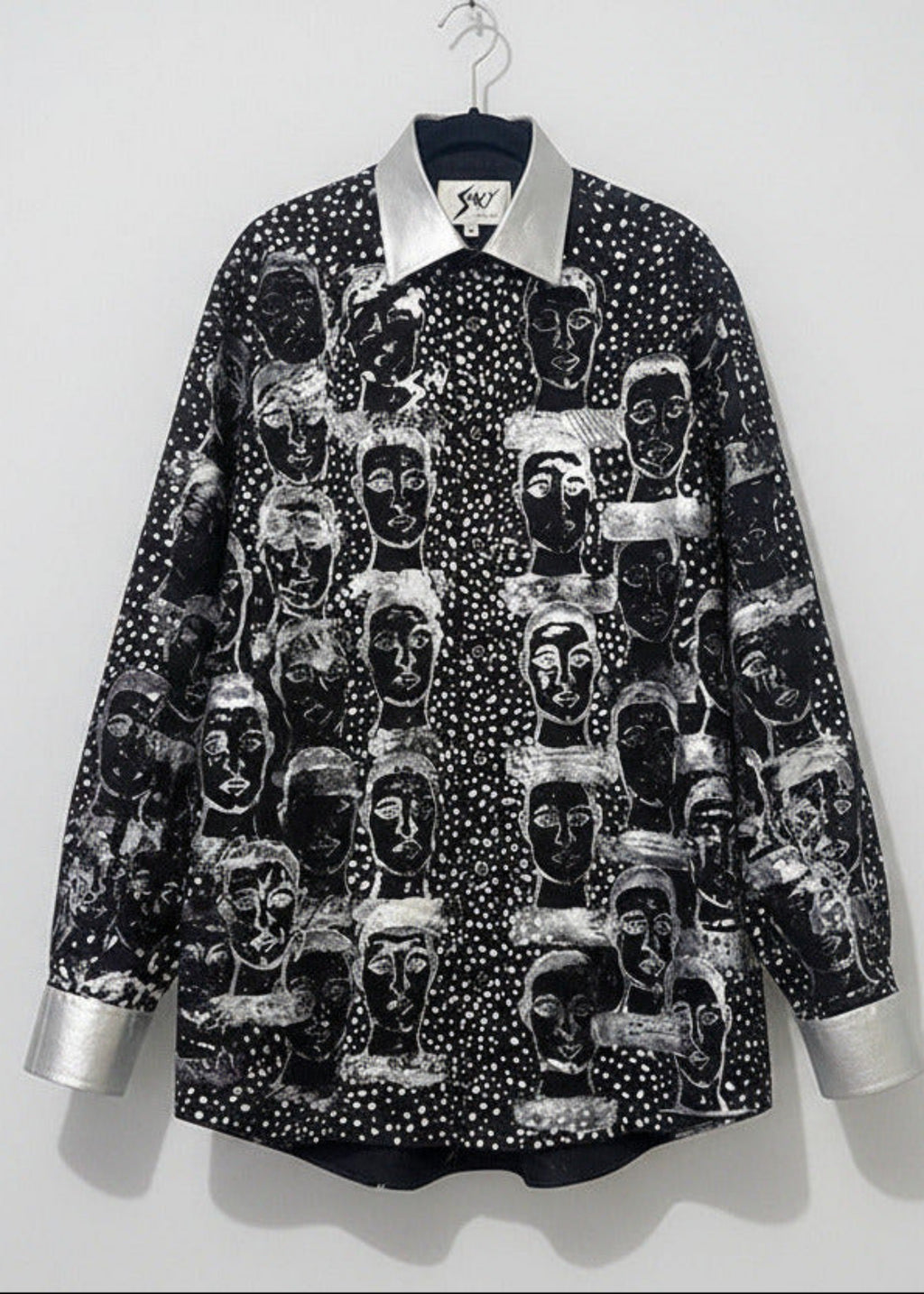 Stacy Stewart Smith Men’s Pawns in Silver on Black Hand-Painted Premium Cotton Percale Dress Shirt on a hanger with a white backdrop