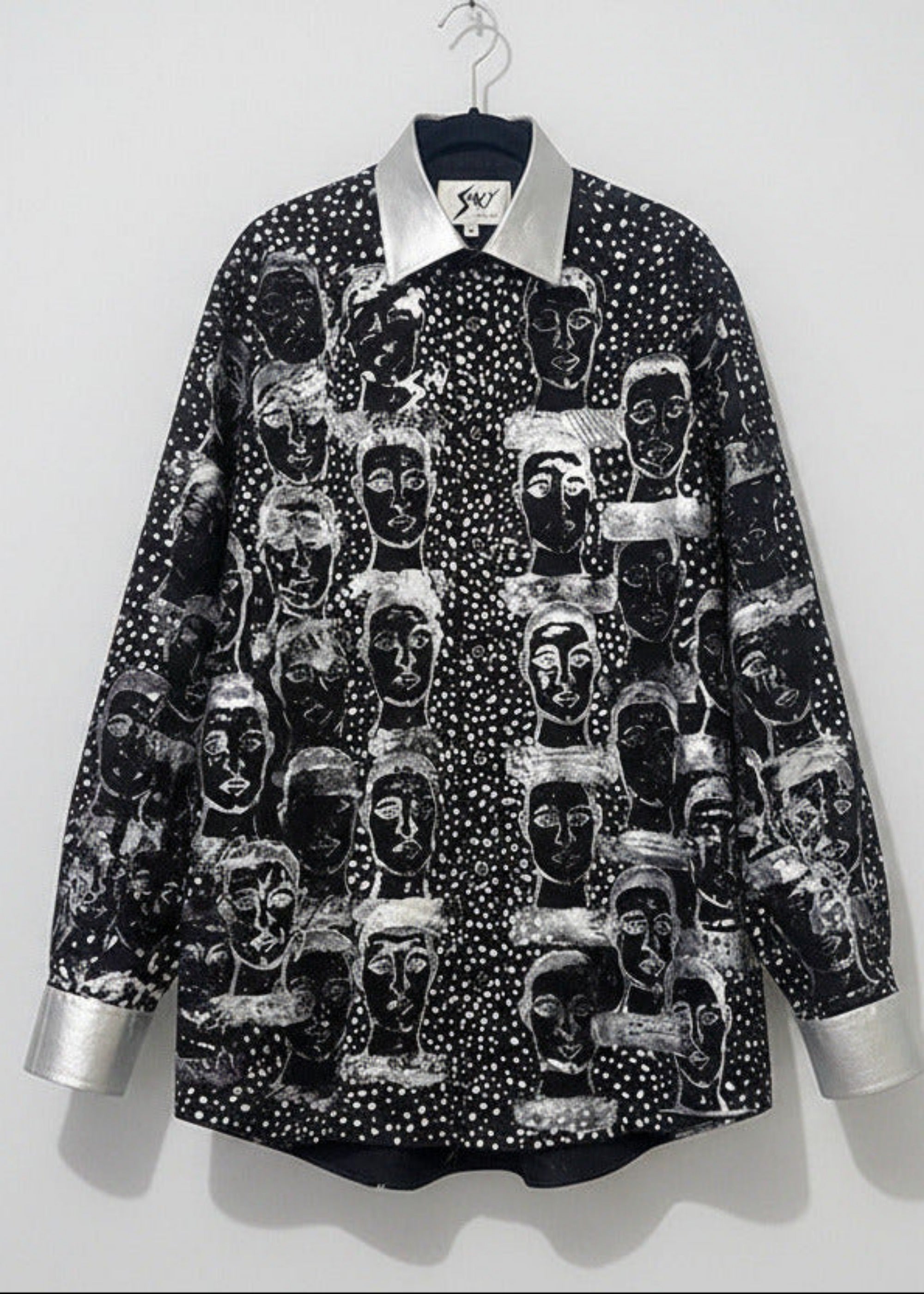 Stacy Stewart Smith Men’s Pawns in Silver on Black Hand-Painted Premium Cotton Percale Dress Shirt on a hanger with a white backdrop