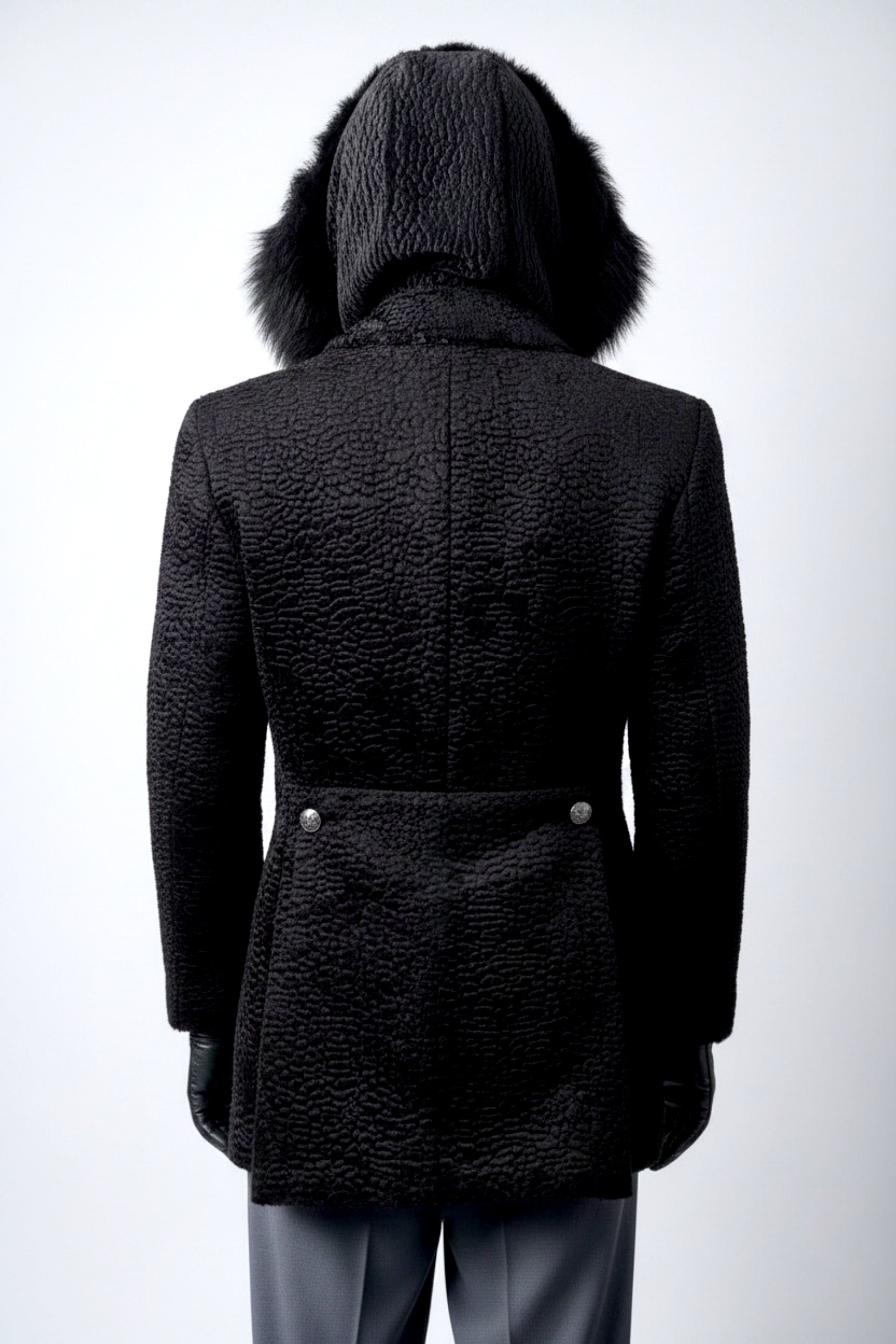 Stacy Stewart Smith Men's Black Knight Faux Persian Lamb Coat in Coal Black, back view shown with hood up on mannequin at 6'3