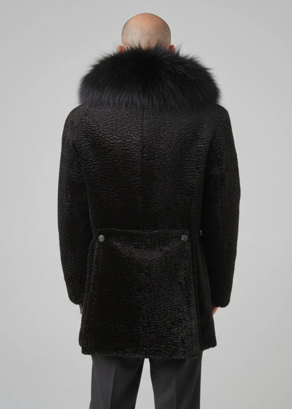 Stacy Stewart Smith Men's Black Knight Faux Persian Lamb Coat in Coal Black, back view shown on mannequin at 6'3