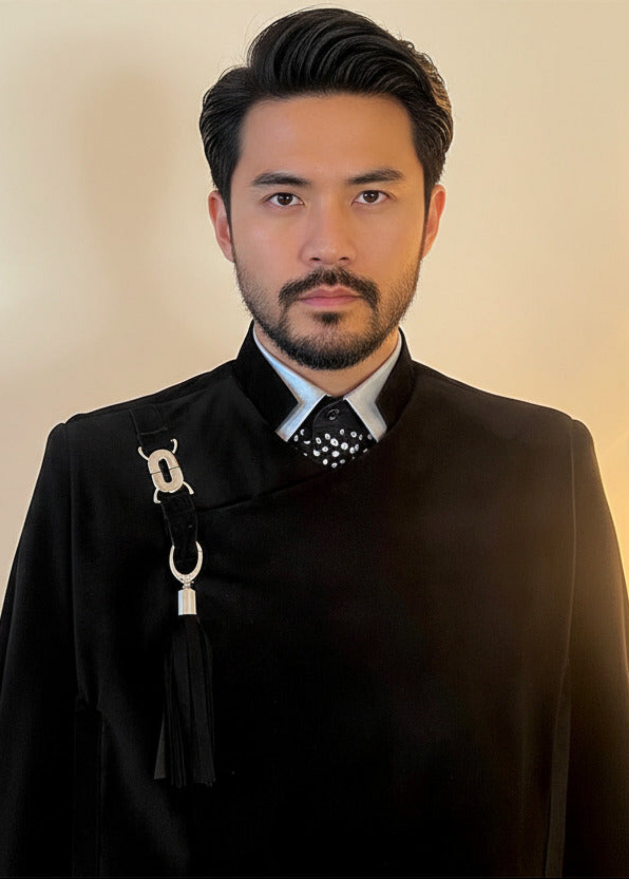 Stacy Stewart Smith Men's Suede Paris Opera Cape on mannequin 6'3" frontal close view and warmly lit background. 