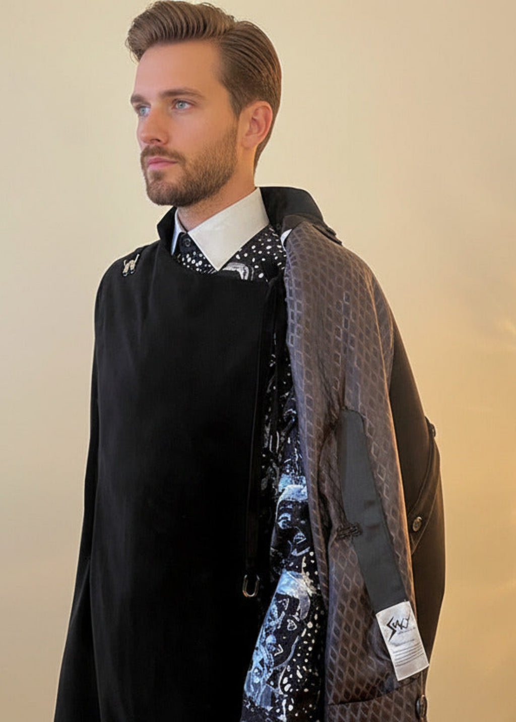 Stacy Stewart Smith Men's Suede Paris Opera Cape over print shirt on mannequin 6'3" frontal view with part of cape open and warm soft lit background.
