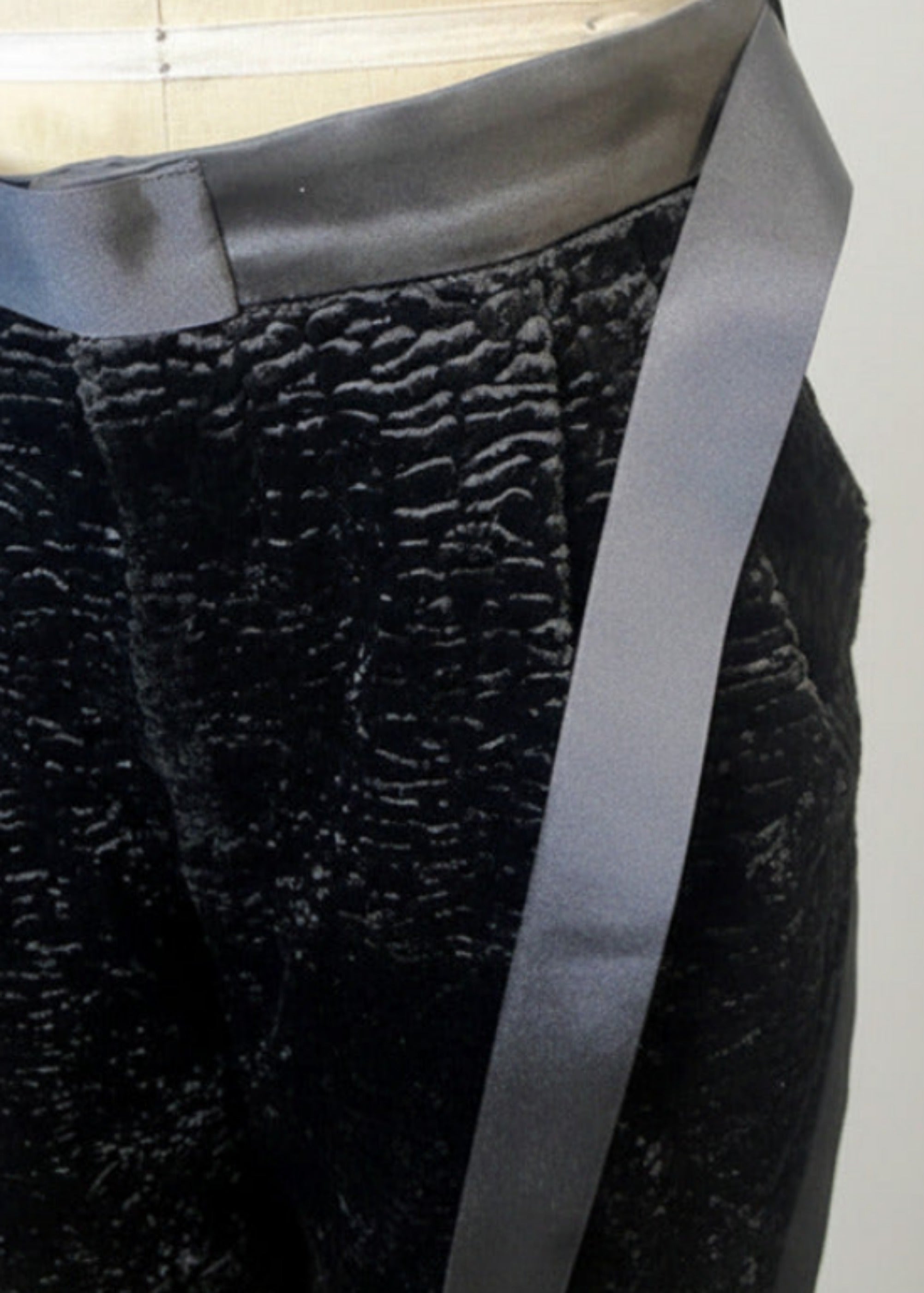 Stacy Stewart Smith Men's Faux Persian lamb pleated Windsor pants, shown on a Wolf form revealing waistband grosgrain ribbon sash.
