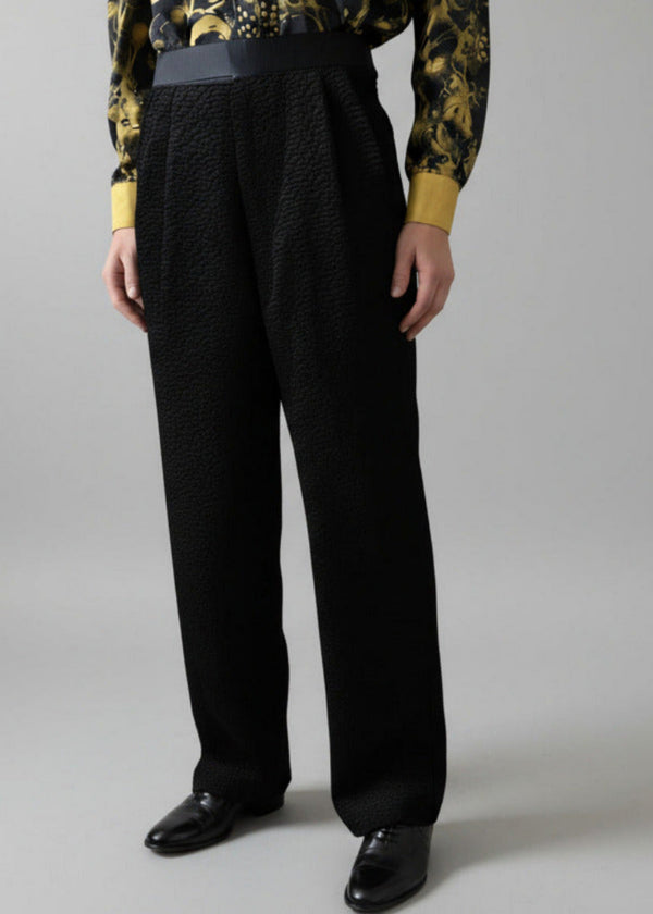 Stacy Stewart Smith Men's Onyx Faux Persian lamb pleated Windsor pants, shown on mannequin at 6'3
